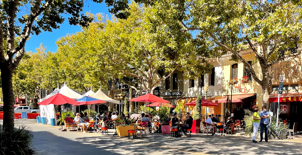 Sidewalk cafes and tree-lined streets along University Avenue in downtown Palo Alto, the heart of the Peninsula.